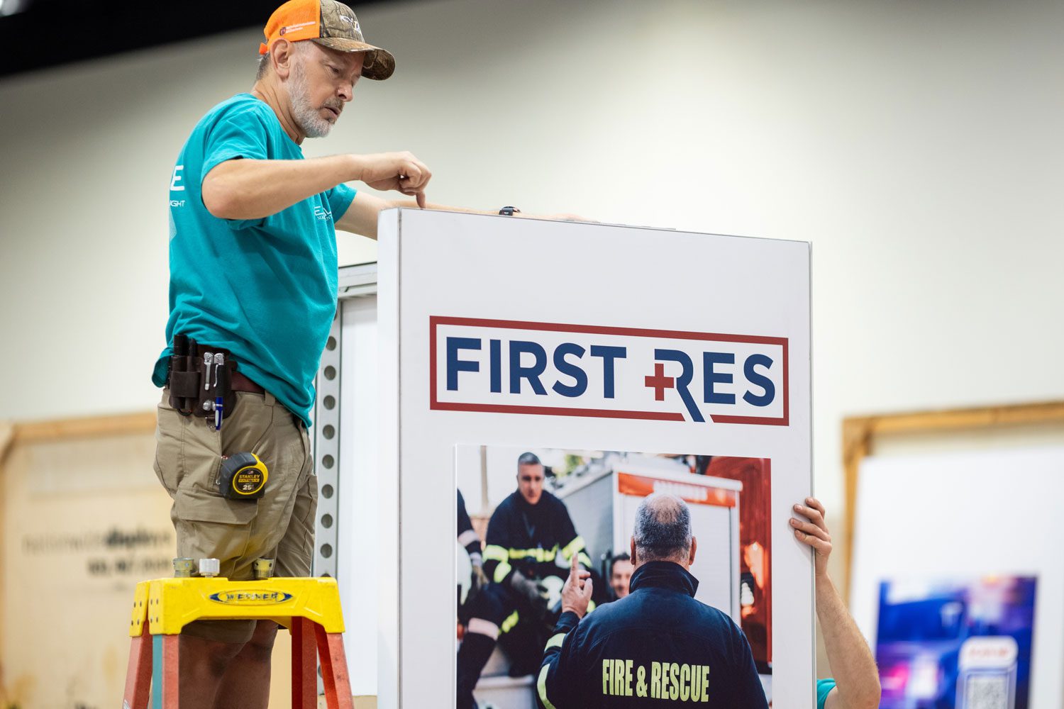 Exhibitor setting up sign in booth | Texas EMS Conference